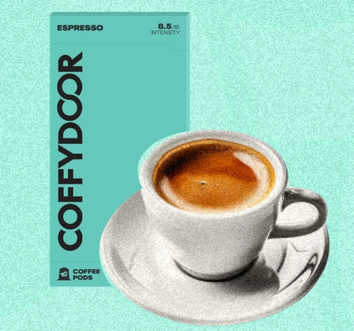 Coffydoor Espresso pod box beside a cup of espresso with crema