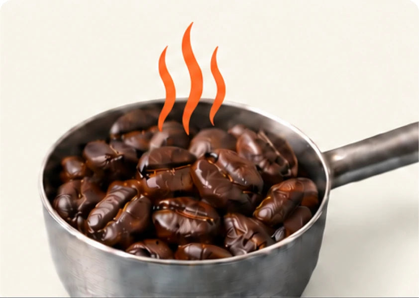 Dark roasted coffee beans in a metal scoop with heat rising.